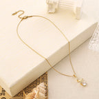 Elegant S-Shape Crystal Pendant Necklace – Gold Finish